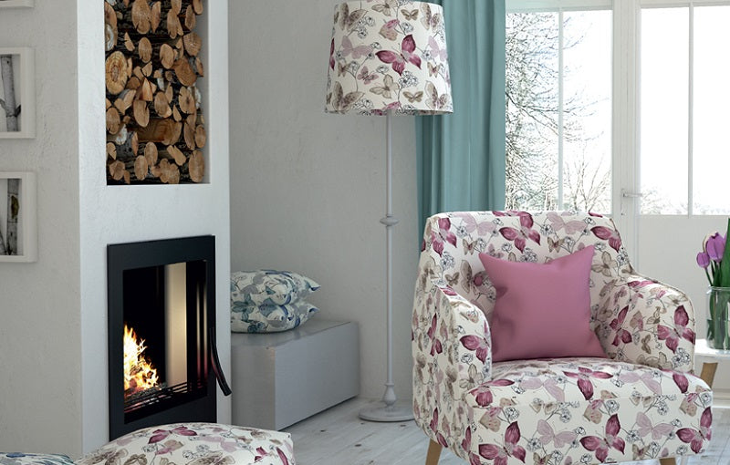 A modern living room featuring a coordinated butterfly pattern theme across the upholstery fabric