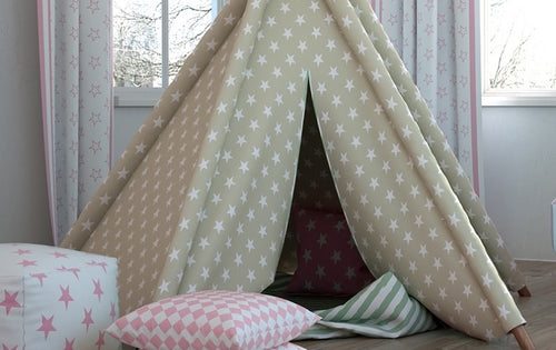 A cozy children's playroom setup highlighting matching upholstery fabric featuring a star pattern.