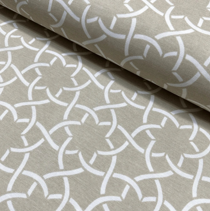 Retro mid century upholstery fabric with a white geometric floral pattern on a beige background.