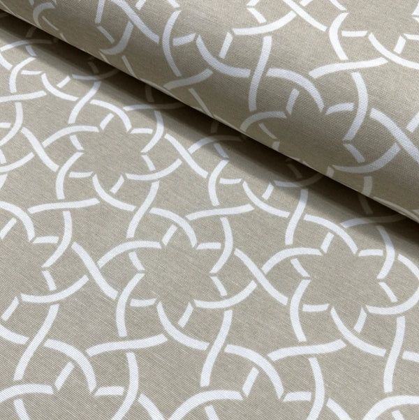 Retro mid century upholstery fabric with a white geometric floral pattern on a beige background.