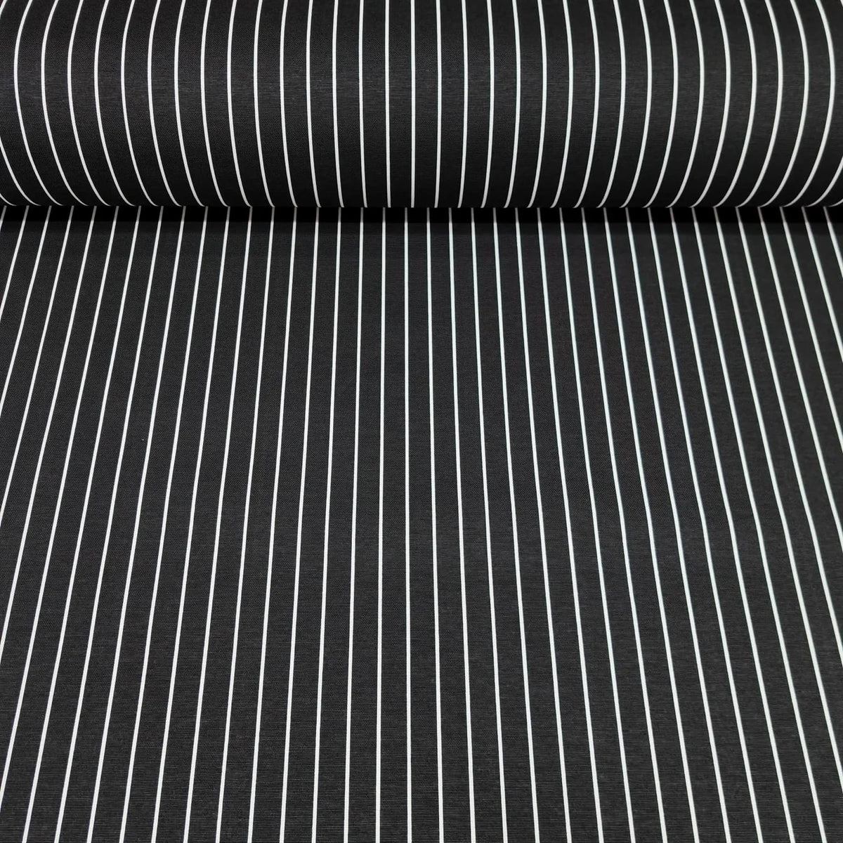 Roll of black fabric with white vertical pin stripes cotton canvas upholstery fabric