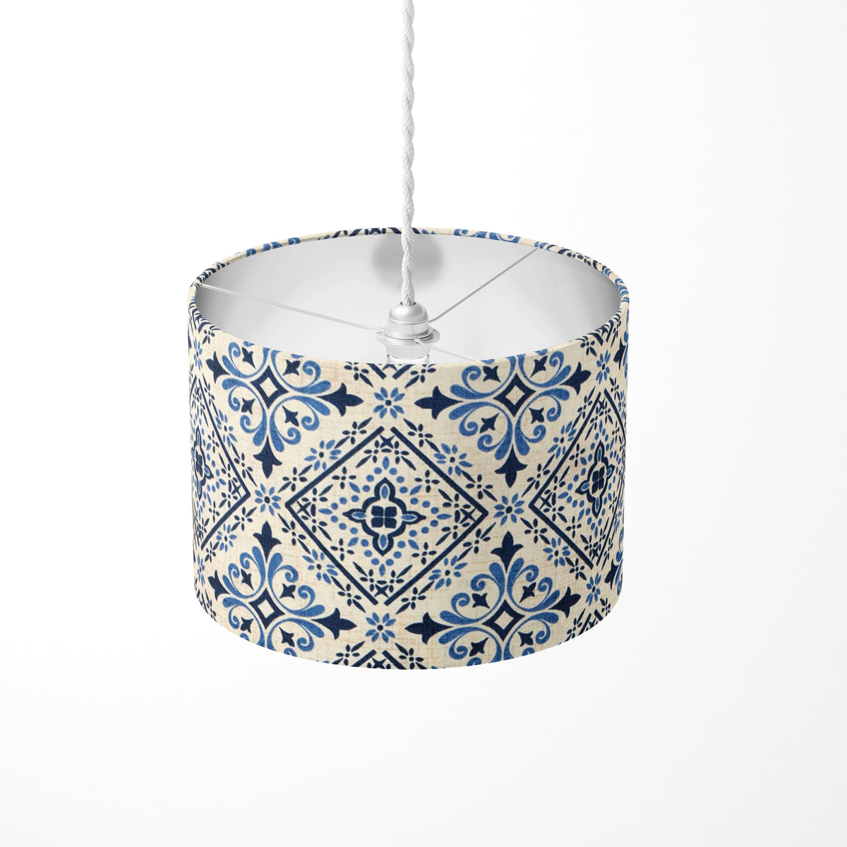 Decorative tile print lampshade with blue geometric pattern on a white background.