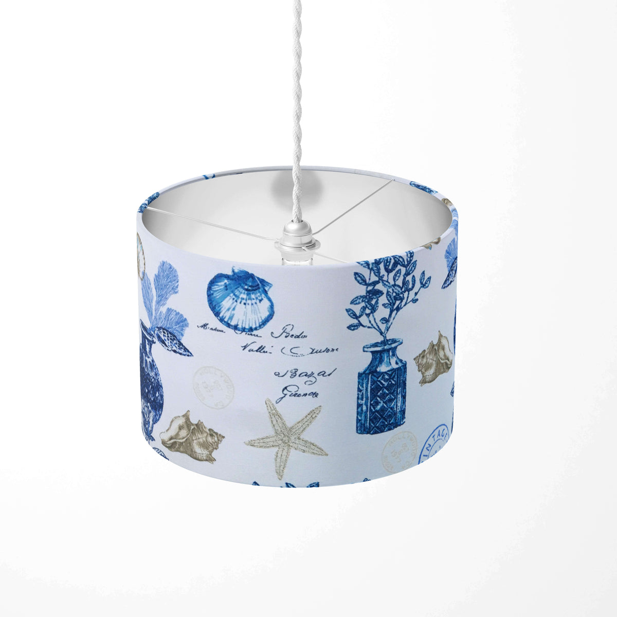 Ceiling lampshade with blue and white design featuring seashells and flower vases on a white background.