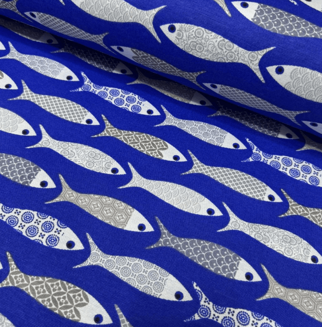Grey and blue fish print fabric on a royal blue background.