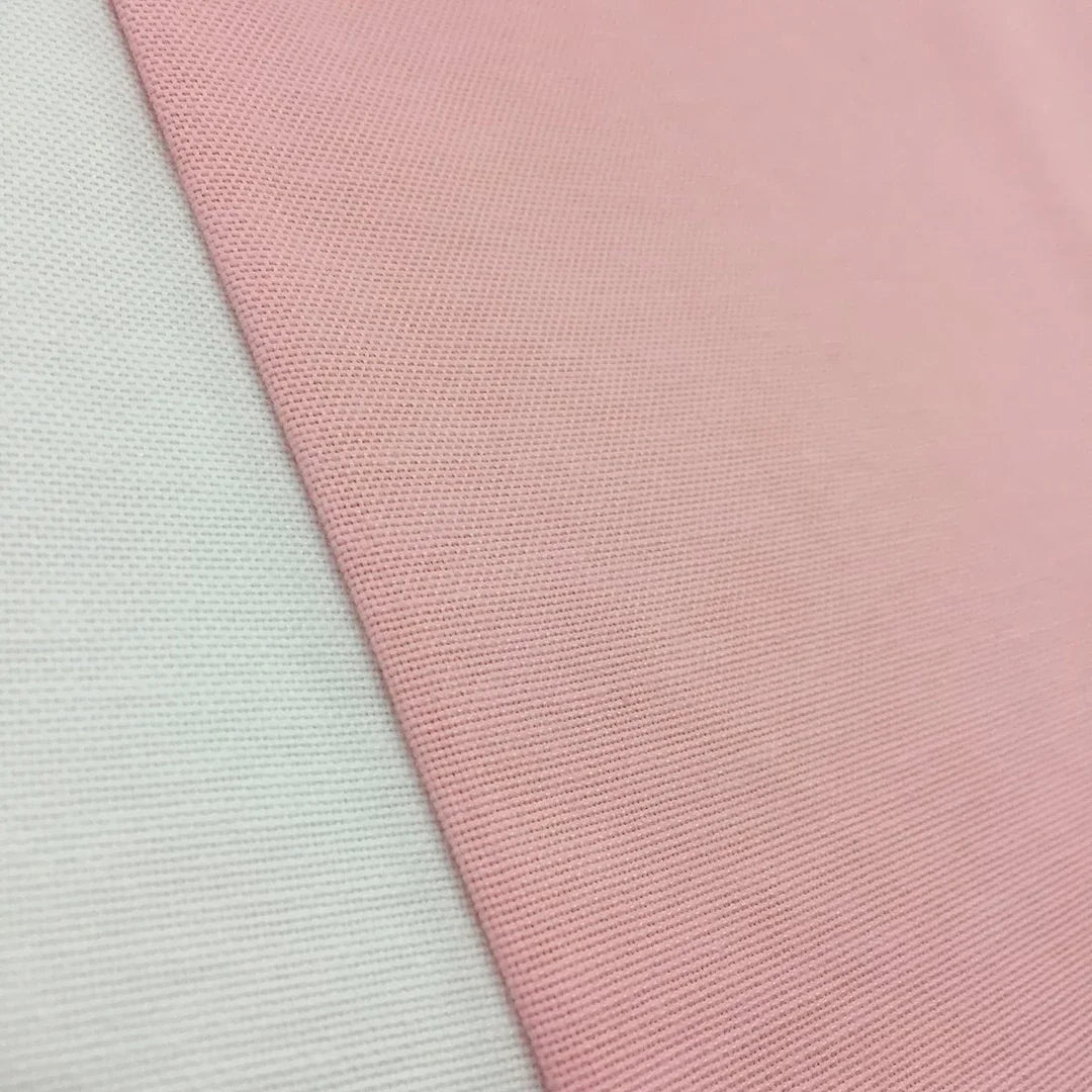 Blush pink plain cotton canvas fabric ideal for upholstery, curtains, roman blinds, cushions, chairs, sofas, and soft furnishing projects.