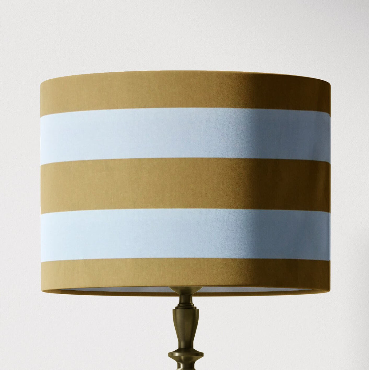 Mustard yellow and white horizontal striped table lampshade.