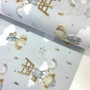 Blue cartoon elephant 100% cotton poplin fabric featuring cute elephants, clouds, rainbows and stars.
