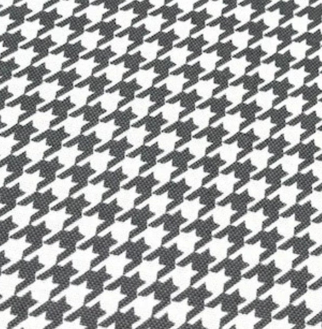Dogtooth print cotton canvas upholstery fabric in grey and white.