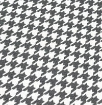 Dogtooth print cotton canvas upholstery fabric in grey and white.