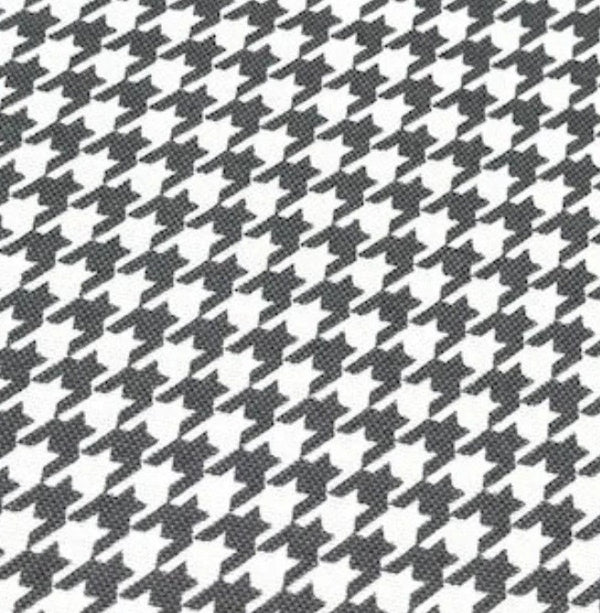 Dogtooth print cotton canvas upholstery fabric in grey and white.