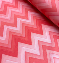 Retro chevron pattern upholstery fabric in pink and red.