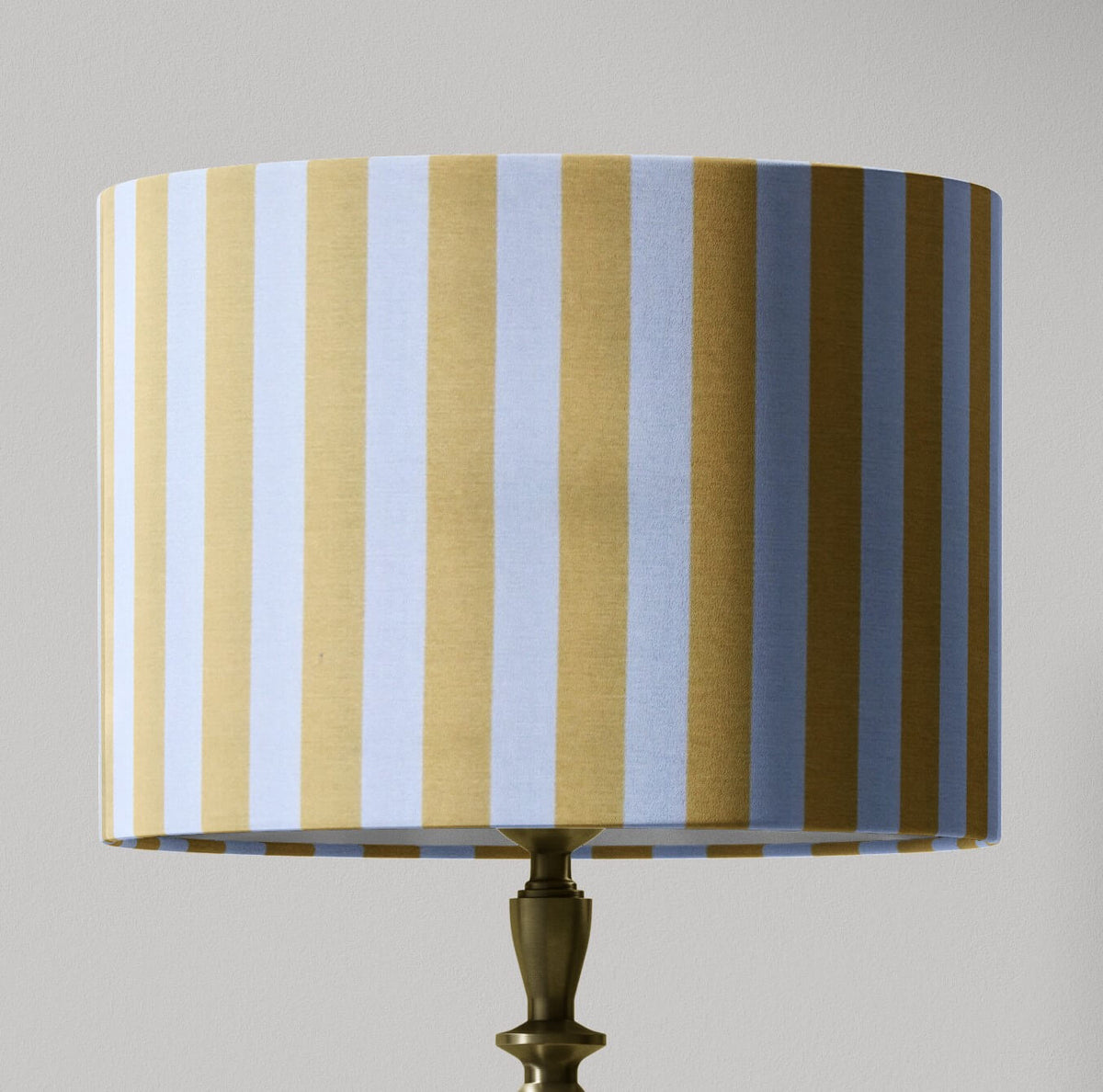 A yellow and white country cottage striped lampshade designed for table lamps, floor lamps, or ceiling pendants. 