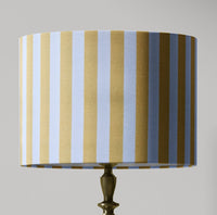 A yellow and white country cottage striped lampshade designed for table lamps, floor lamps, or ceiling pendants. 