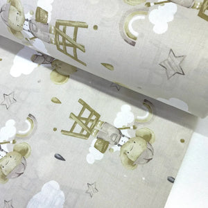 Beige elephant nursery 100% cotton poplin fabric featuring cute elephants, rainbows, clouds and stars for baby quilts, children's clothing and nursery décor.