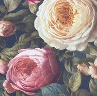 Close-up of cream and pink rose patterned upholstery curtain fabric.