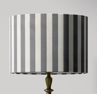 Modern vertical stripe patterned handmade lampshade in grey and white.