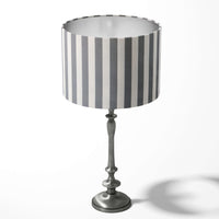 Table drum lampshade with a modern grey white striped pattern on a white background.