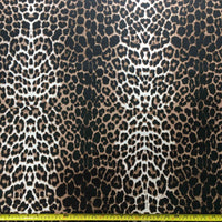 Leopard print fabric with a ruler at the bottom for scale.