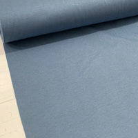 Indigo blue plain cotton canvas fabric in a steel blue shade, for upholstery, curtains, cushions, chairs and home décor projects.