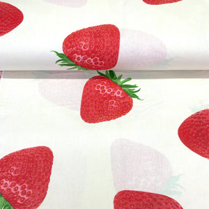 Large strawberry print cotton fabric on a white background with realistic red strawberries, ideal for dressmaking, quilting, crafts and home decor.