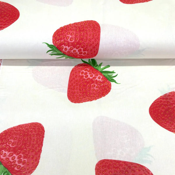 Large strawberry print cotton fabric on a white background with realistic red strawberries, ideal for dressmaking, quilting, crafts and home decor.