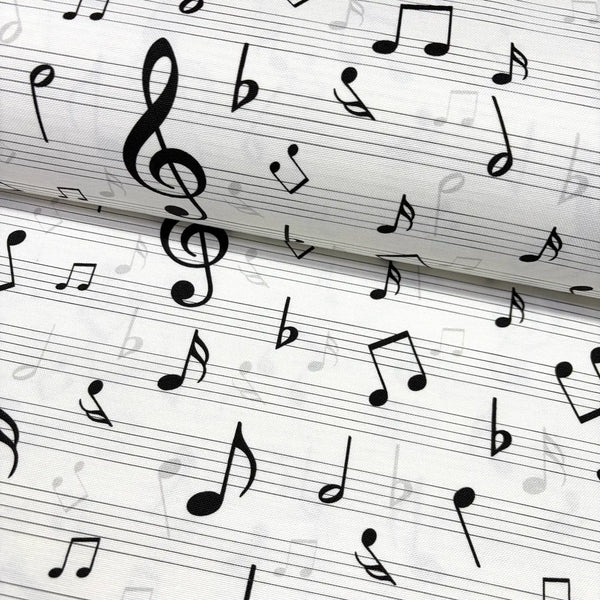 Music sheet fabric with black notes on a white background.