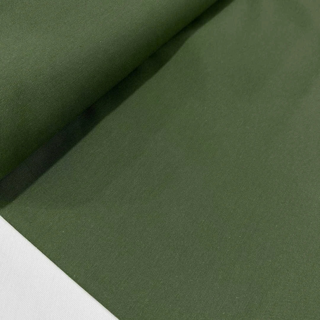 Olive green cotton canvas fabric ideal for upholstery, curtains, chair covers, cushions, bags and home décor sewing projects.