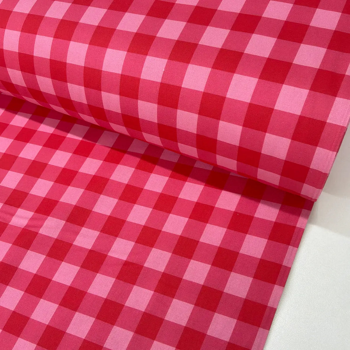 Red and pink checkered cotton poplin fabric.