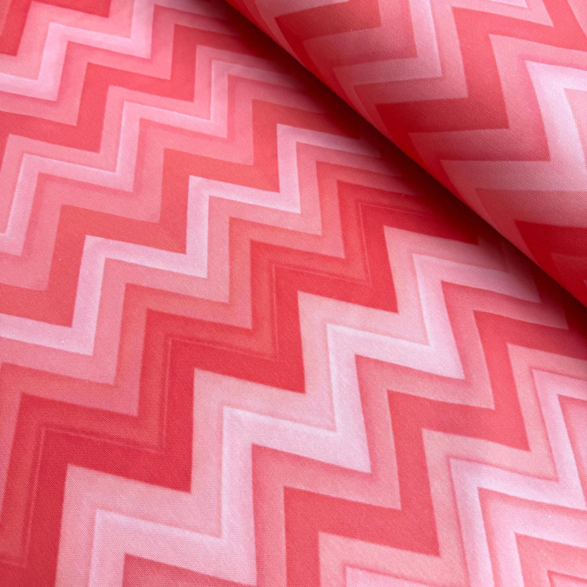 Coral pink red zig zag print upholstery curtain fabric.