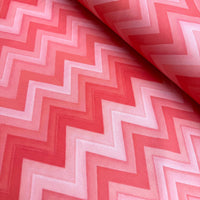 Coral pink red zig zag print upholstery curtain fabric.