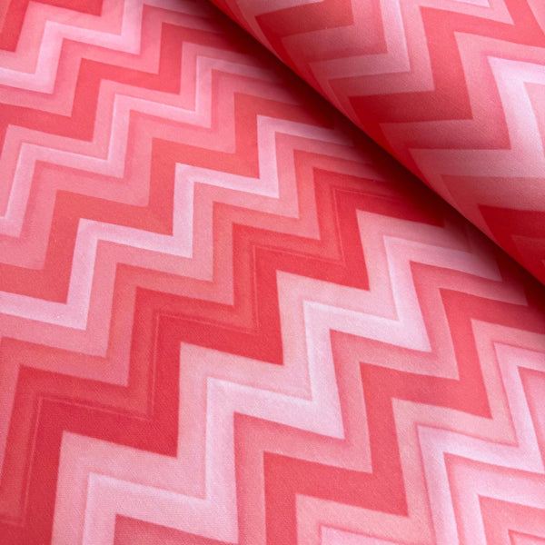 Coral pink red zig zag print upholstery curtain fabric.