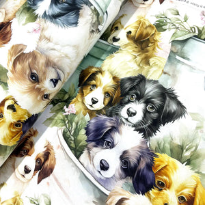 Watercolour puppy dog cotton poplin fabric featuring realistic illustrated puppies with botanical greenery on a light background.