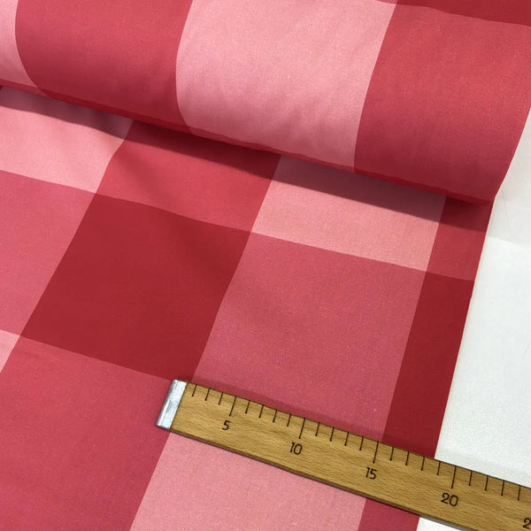 Red and pink large check gingham 100% cotton fabric with an oversized buffalo plaid pattern, ideal for quilting, sewing, patchwork, crafts, and home décor.
