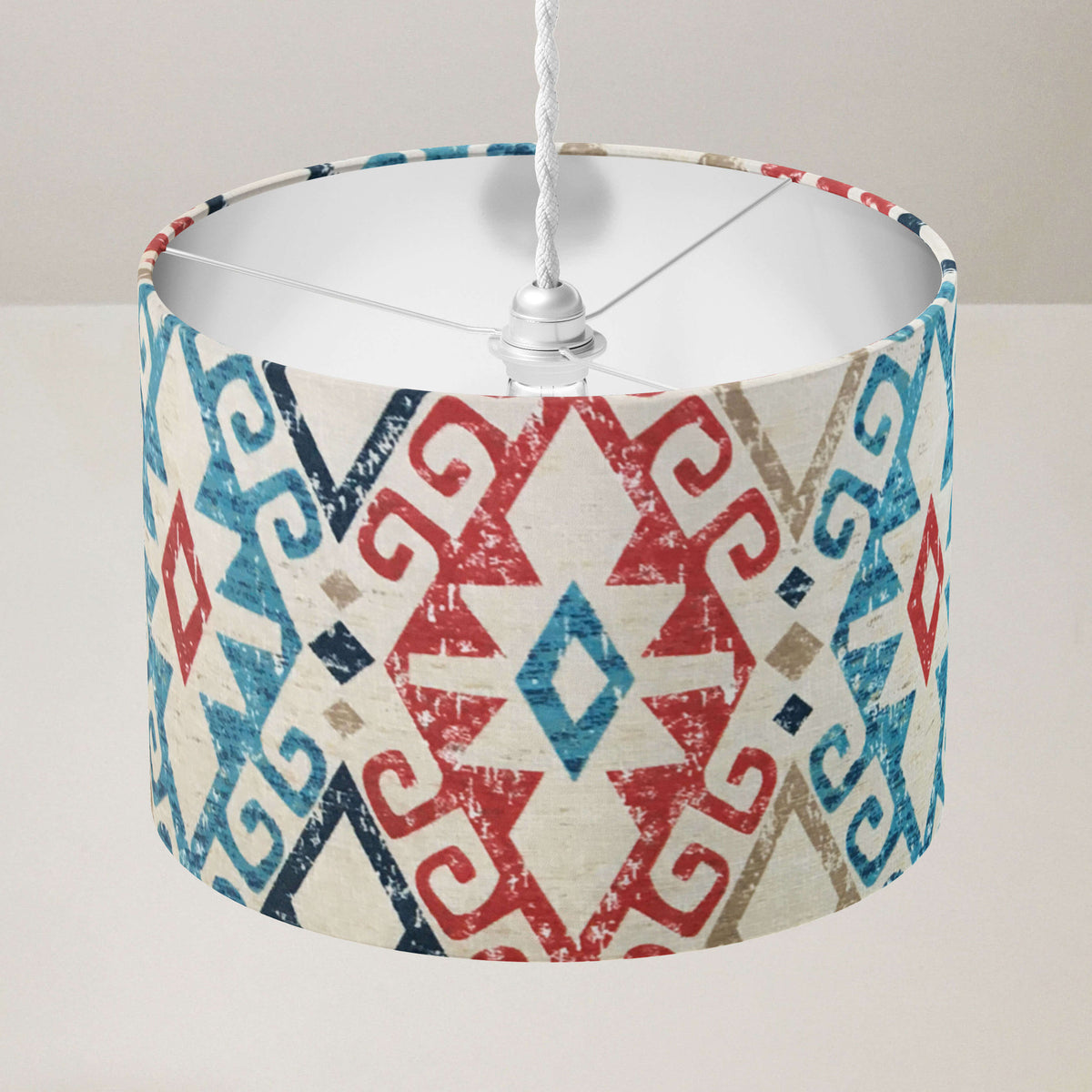 Red, blue, navy and beige oriental kilim patterned ceiling lampshade.