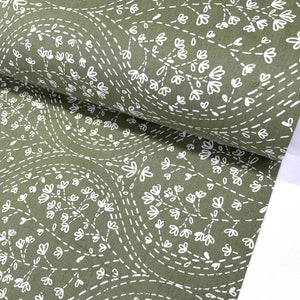 Sage green floral fabric featuring a white floral vine and dotted trail print, ideal for quilting, dressmaking, patchwork, crafts and home décor.