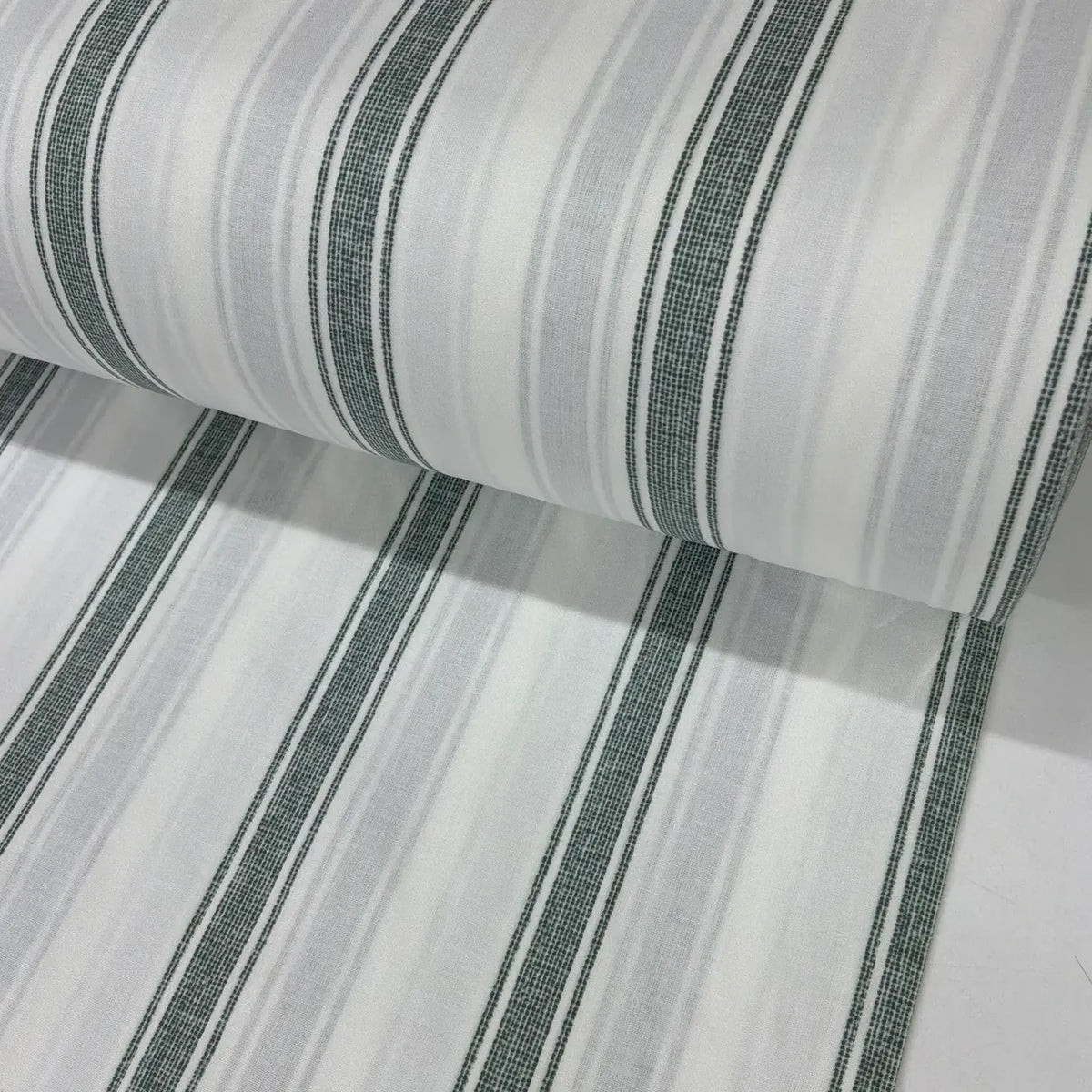 Sage green and white ticking stripe 100% cotton fabric with a subtle linen-look print, ideal for dressmaking, quilting, patchwork and rustic home décor projects.