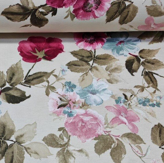 Shabby chic neutral floral fabric with pink and blue flowers on a beige background.