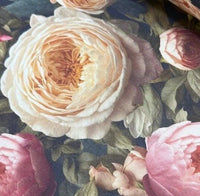 Close up of shabby chic cream and pink vintage rose patterned upholstery curtain fabric.