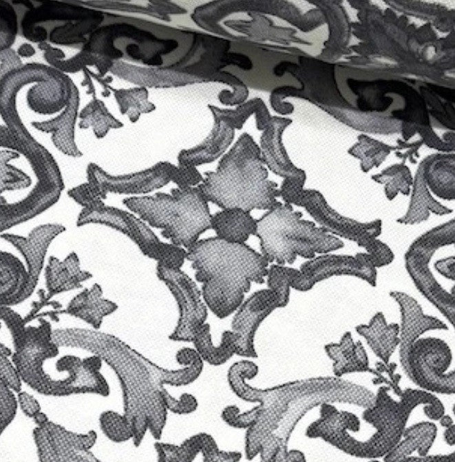 Close up of a grey and white majolica fabric.