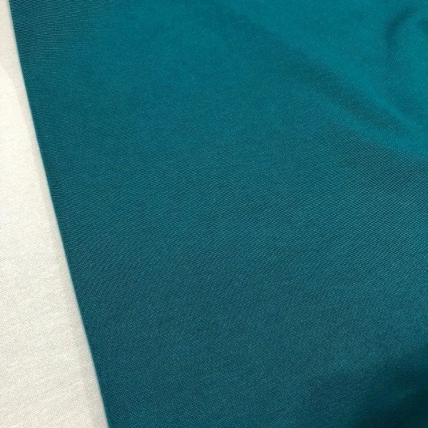 Teal cotton canvas fabric in a plain peacock blue shade, perfect for upholstery, curtains, cushions sofas and chairs.