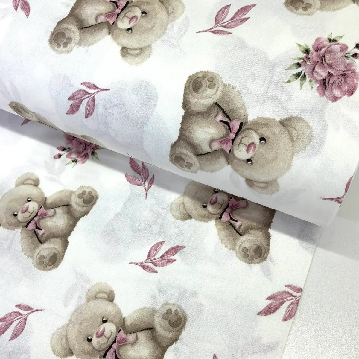 Floral and teddy bear patterned 100% cotton poplin fabric.