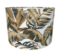 Close-up of a botanical leaf pattern lampshade on a white background.
