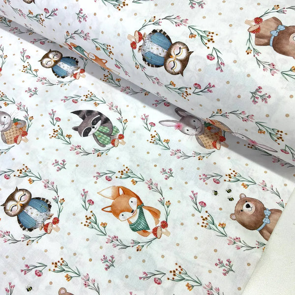 Woodland animal 100% cotton poplin fabric featuring a fox, owl, rabbit, bear and raccoon with wildflowers and toadstools on a soft white background.
