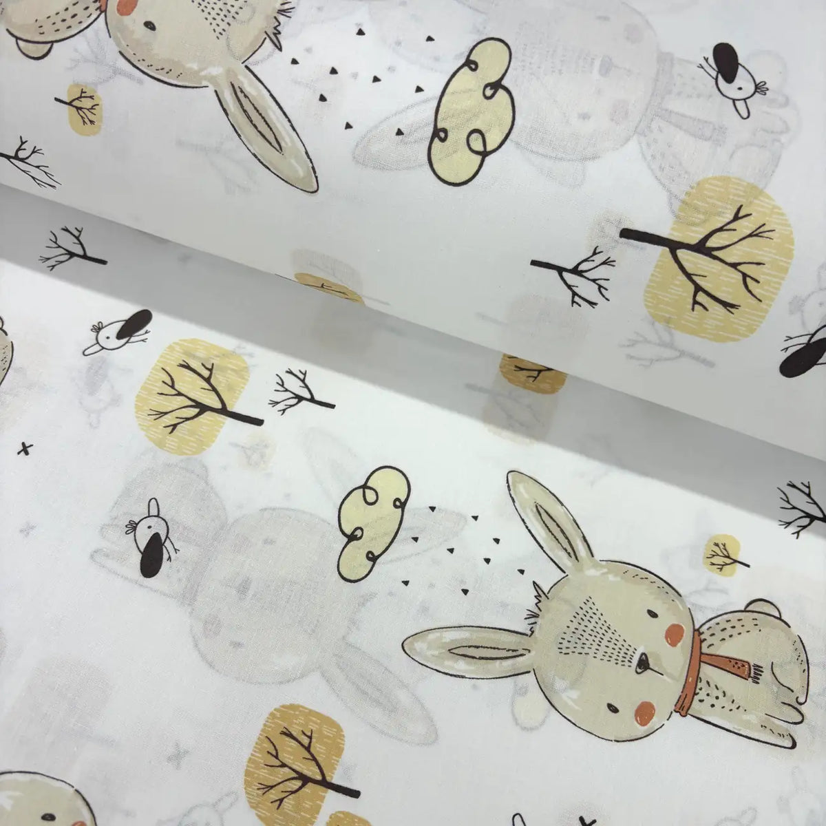 Children's woodland fabric with bunny and tree pattern on a white background.