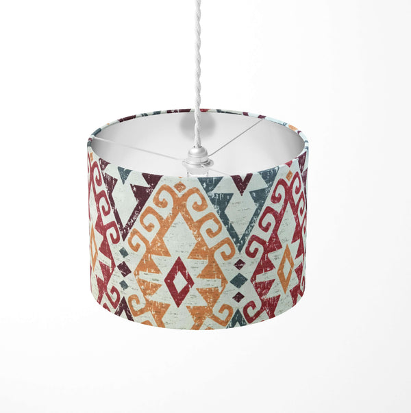 Decorative ceiling lampshade with burgundy red orange and grey geometric pattern on a white background.