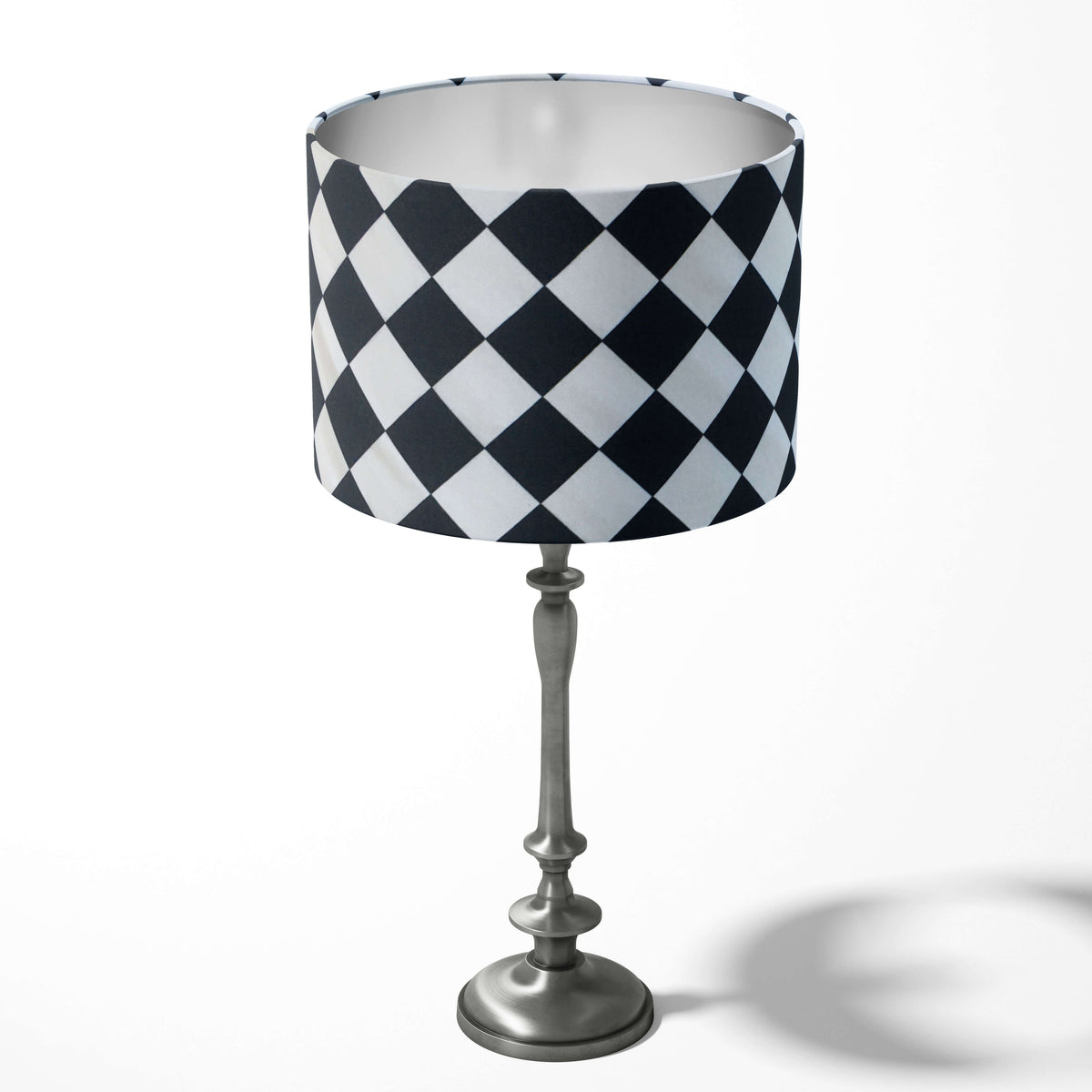 Table lampshade with a black and white diagonal square pattern on a white background.