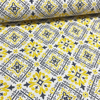 Spanish tile pattern cotton canvas upholstery curtain fabric with yellow and grey geometric shapes.