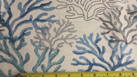 Blue ocean fabric with grey, blue and green coral reefs on an ivory background.