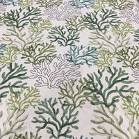 Green ocean fabric with a coral reef pattern on a white background, suitable for upholstery and curtain projects.