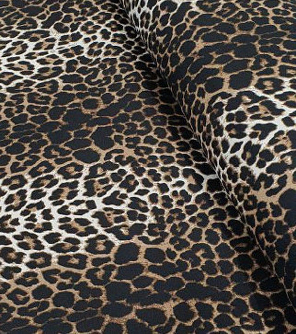 Close up of leopard print upholstery fabric in light brown and dark brown colours.